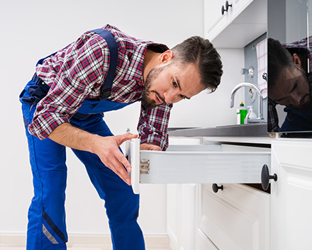 Man Installing a Kitchen Drawer